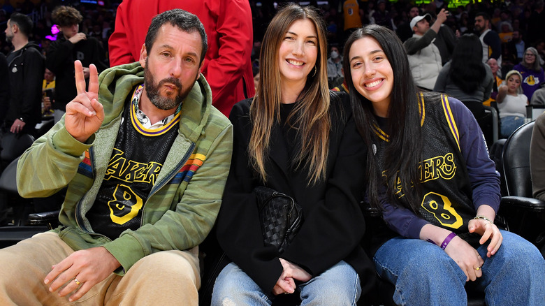 Adam Sandler, Jackie Sandler, and Sadie Sandler at basketball game