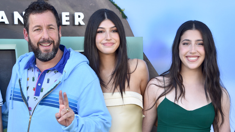 Adam Sandler, Sunny Sandler, and Sadie Sandler posing