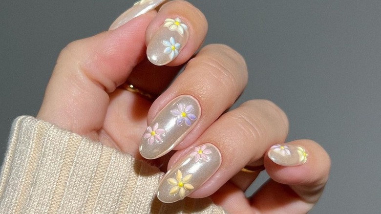 vanilla chrome nails with colored flowers