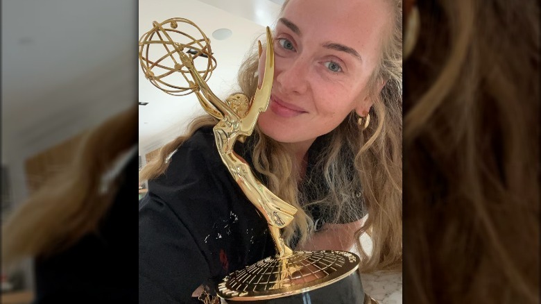 Adele posing with her Emmy