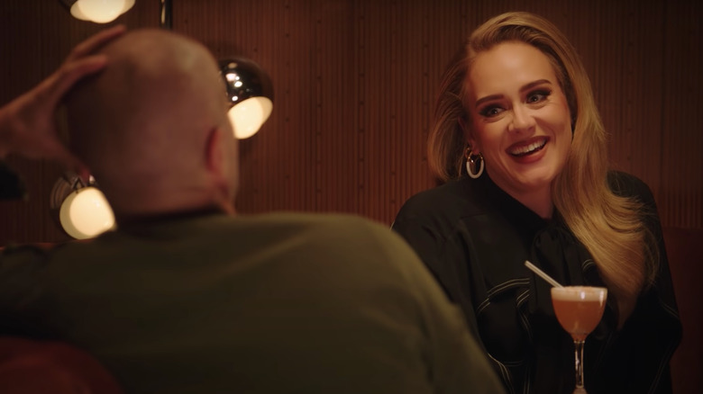 Adele laughing during Apple Music interview with Zane Lowe