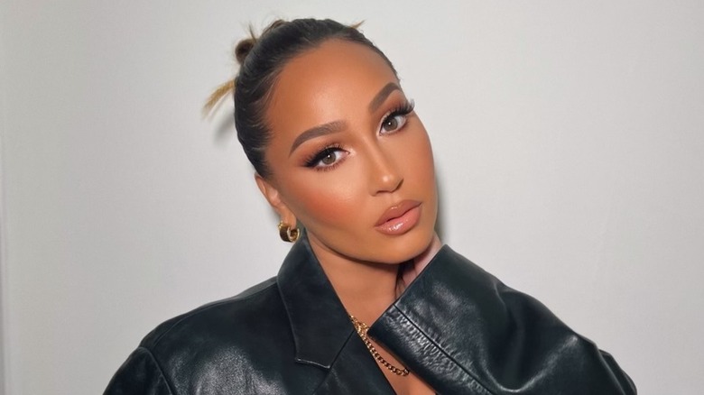 Adrienne Bailon-Houghton posing