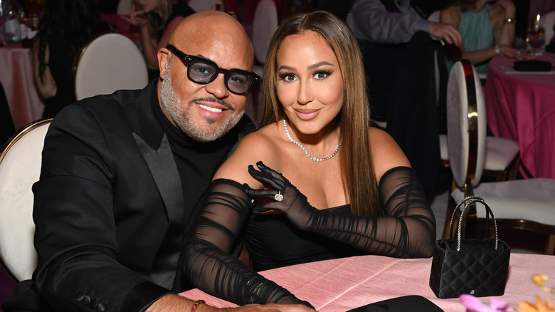 Israel Houghton and Adrienne Bailon-Houghton smiling at event