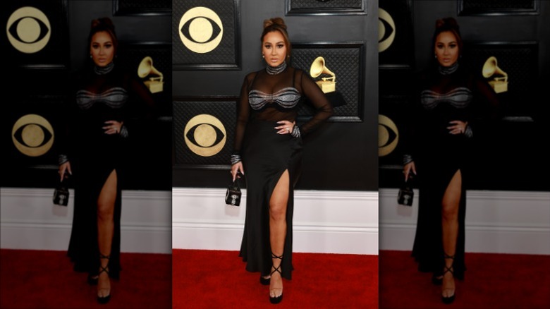 Adrienne Bailon-Houghton posing at the 2023 Grammys