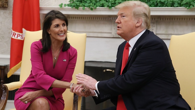 Nikki Haley and Donald Trump holding hands