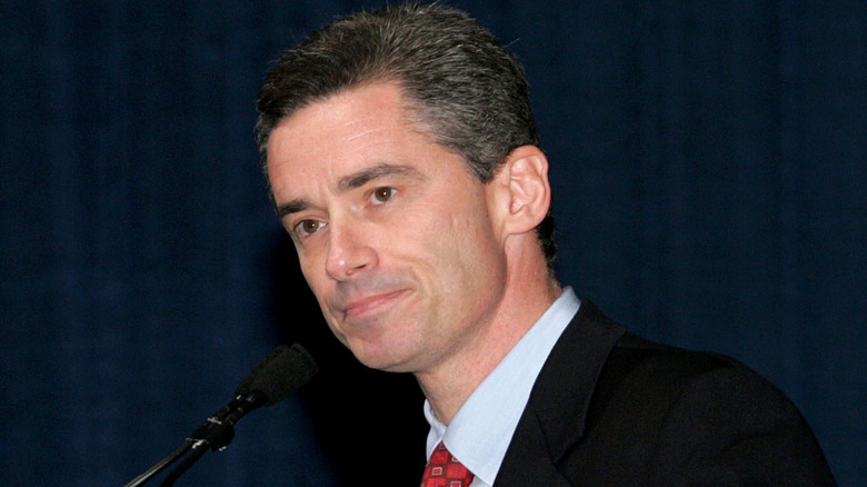 Jim McGreevey standing in front of microphone