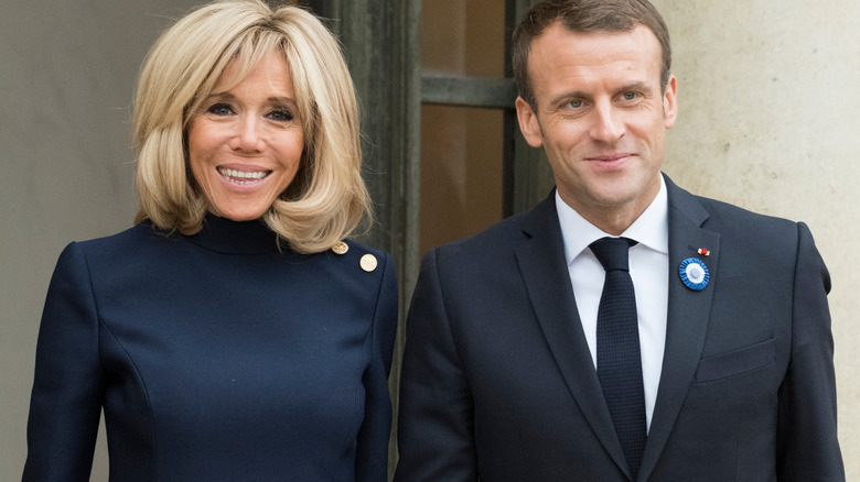 President Emmanuel Macron and wife smiling