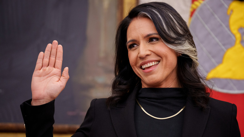 Tulsi Gabbard with her hand raised to be sworn in