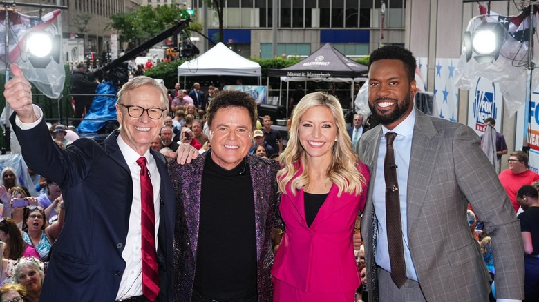 Ainsley Earhardt posing with her "Fox & Friends" colleagues