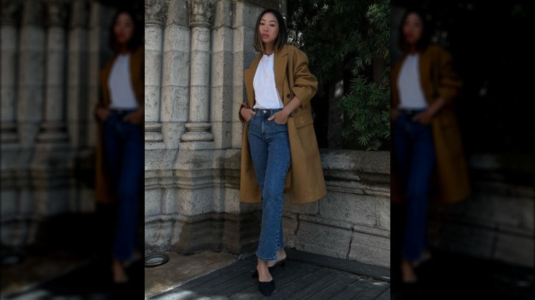 woman wearing white tee, jeans, and flats