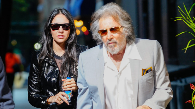 Noor Alfallah and Al Pacino walking together