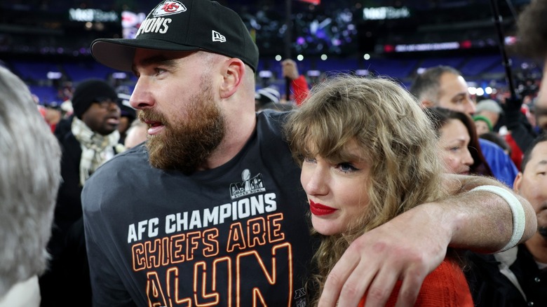 Travis Kelce and Taylor Swift embracing