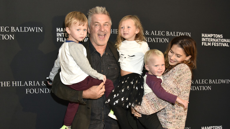 Alec and Hilaria Baldwin laughing with their kids