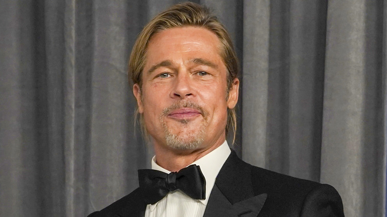 Brad Pitt posing in tuxedo