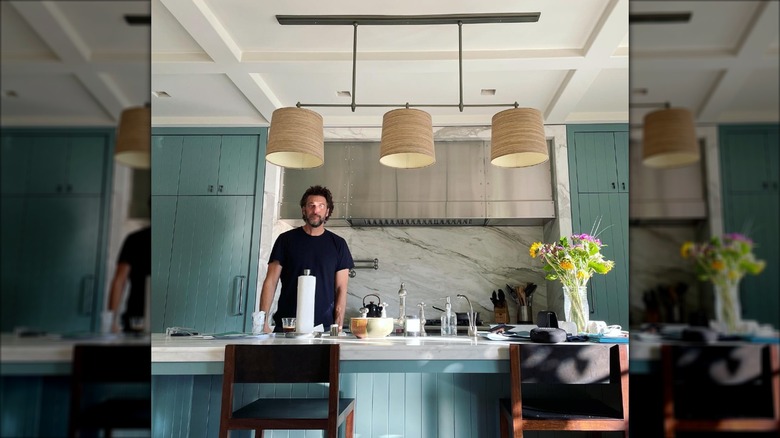 Andrew Form standing in his kitchen