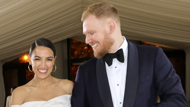 Alexandria Ocasio-Cortez and Riley Roberts smiling