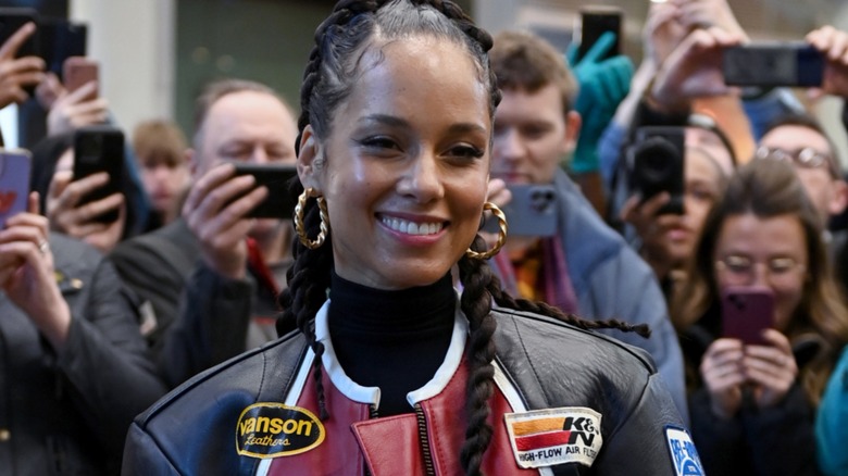 Alicia Keys stands in front of fans