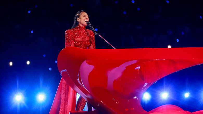 Alicia Keys plays the piano onstage during the 2024 Super Bowl halftime show