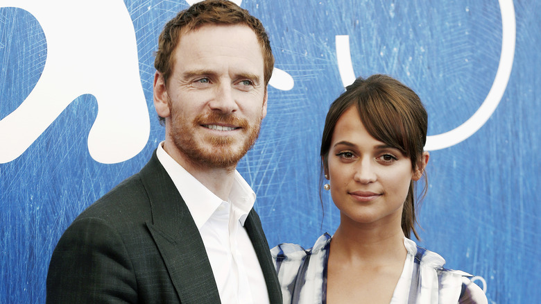 Michael Fassbender and Alicia Vikander on red carpet