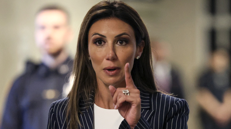 Alina Habba speaking outside a New York court room