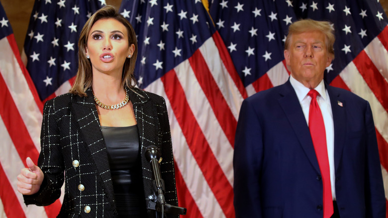 Donald Trump side-eyeing Alina Habba as she speaks