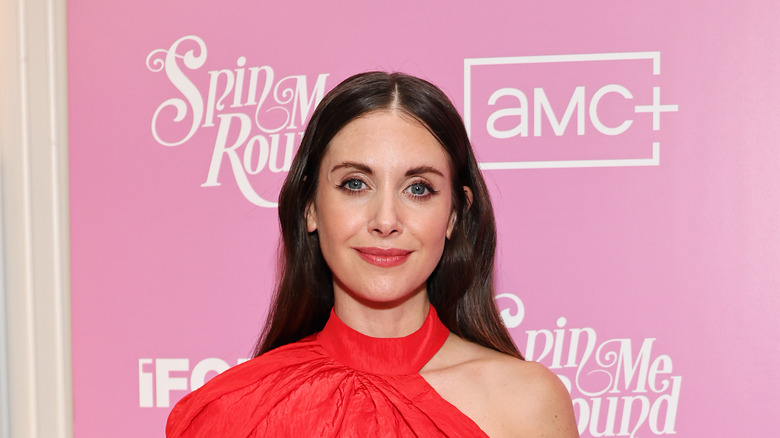 Alison Brie smiling at Spin Me Round event 