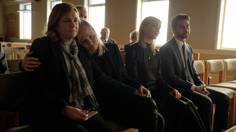 Alison Pill sitting with others