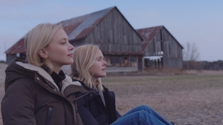 Alison Pill sitting outside