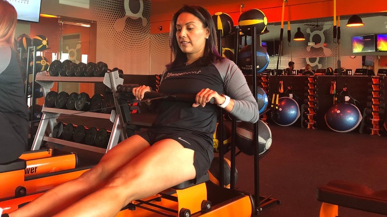 Woman rowing at Orangetheory