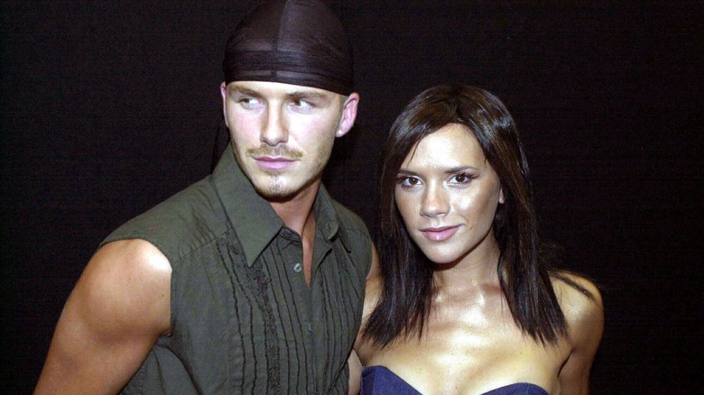 David and Victoria Beckham posing at event