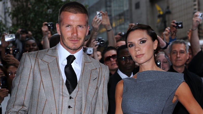 David and Victoria Beckham with crowd