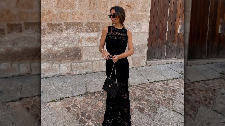 Woman posing in crochet dress