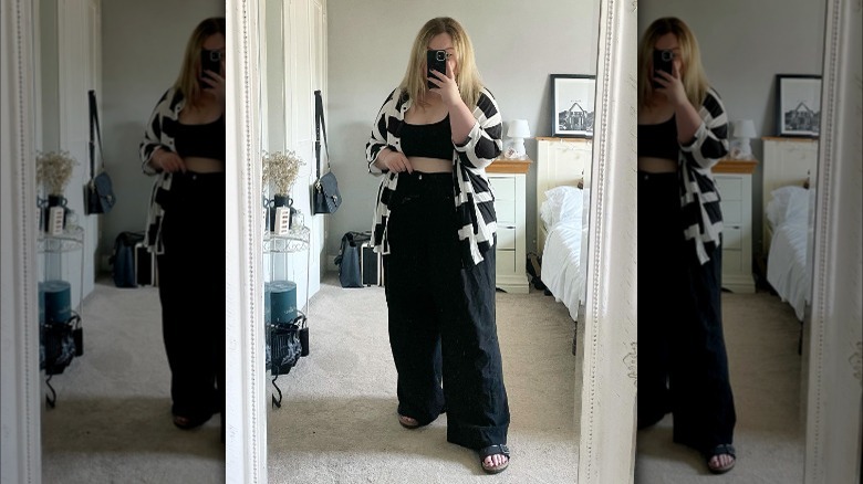 Woman taking mirror selfie