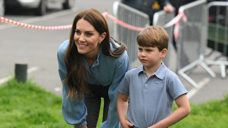 Prince Louis and Kate Middleton standing together