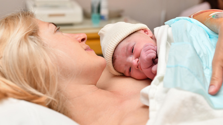 A mom and newborn baby enjoying skin-to-skin contact