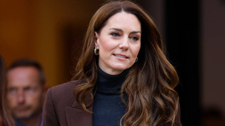 Kate Middleton smiling in a turtleneck