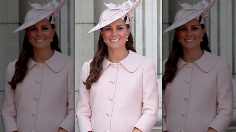 Pregnant Princess Catherine laughing in pink dress and hat