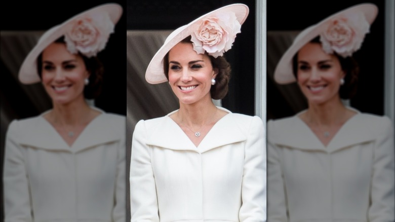 Princess Catherine smiling in large pink hat