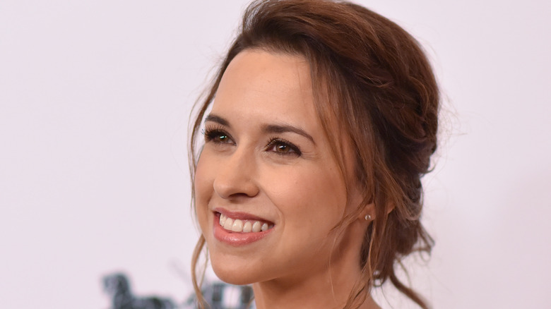 Lacey Chabert looking off to the side