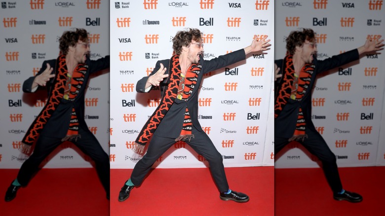 Matthew Gray Gubler dancing on step-and-repeat