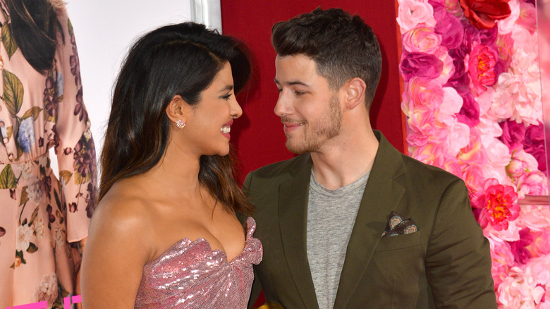 Priyanka Chopra and Nick Jonas smiling at each other