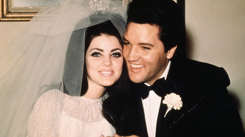 Priscilla Presley and Elvis Presley on their wedding day