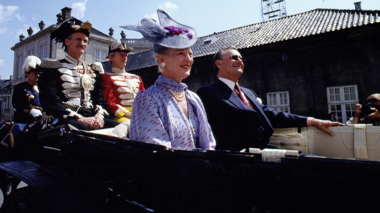 Queen Margrethe riding in a carriage