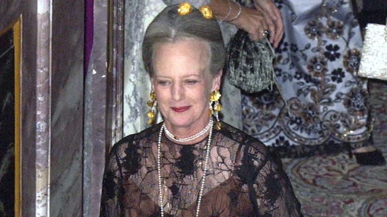 Queen Margrethe walking, wearing formal outfit