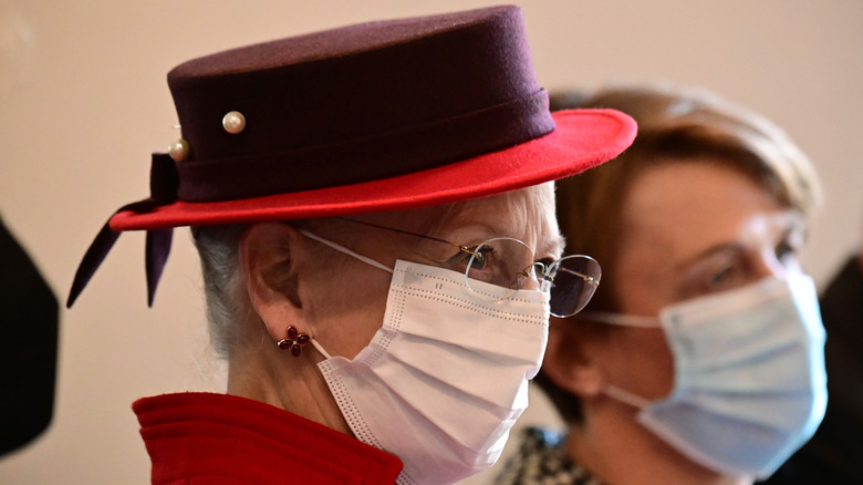 Queen Margrethe wearing a surgical mask