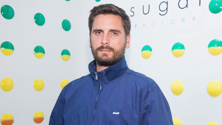 Scott Disick wearing a blue jacket