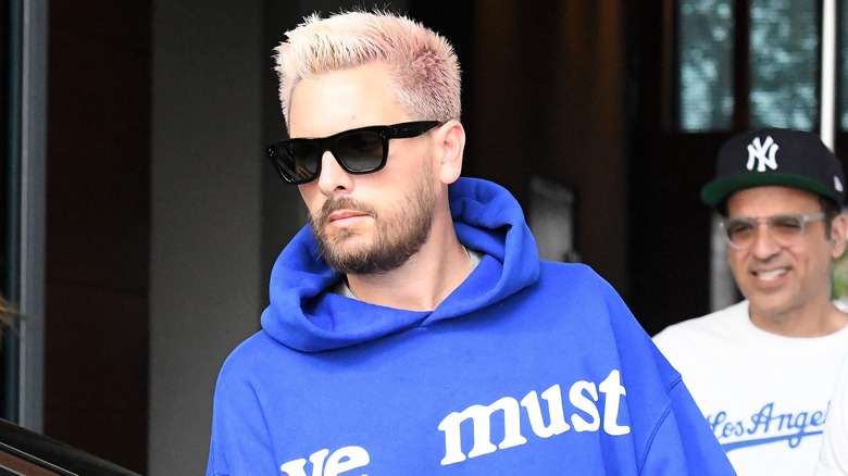 Scott Disick wearing shades and a hoodie