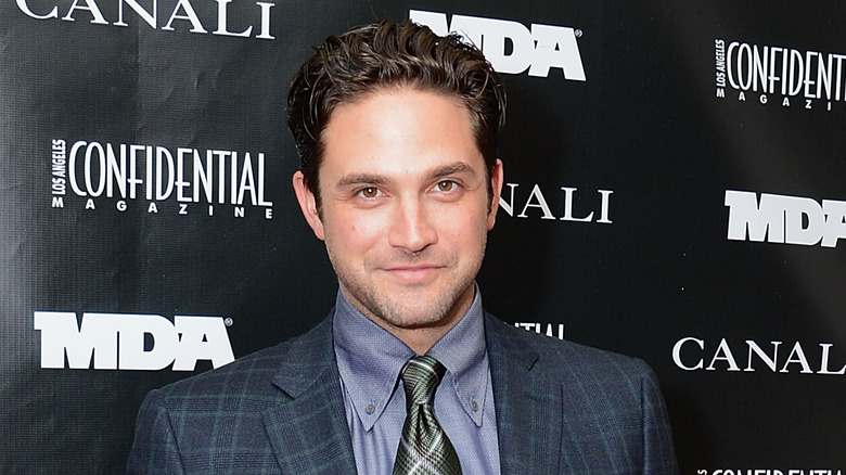 Brandon Barash poses for a photograph on the red carpet. 