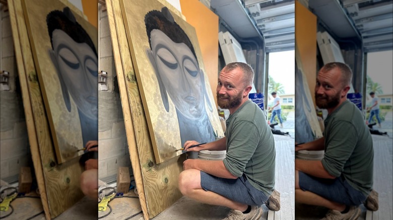 Keith Bynum painting a Buddha portrait on "Rock the Block"