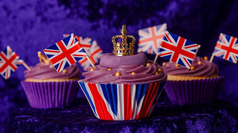 Coronation cupcakes on purple velvet background